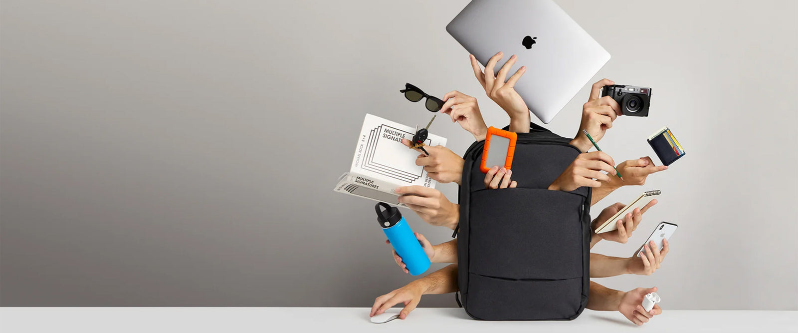 image of a bag with hands coming out with items