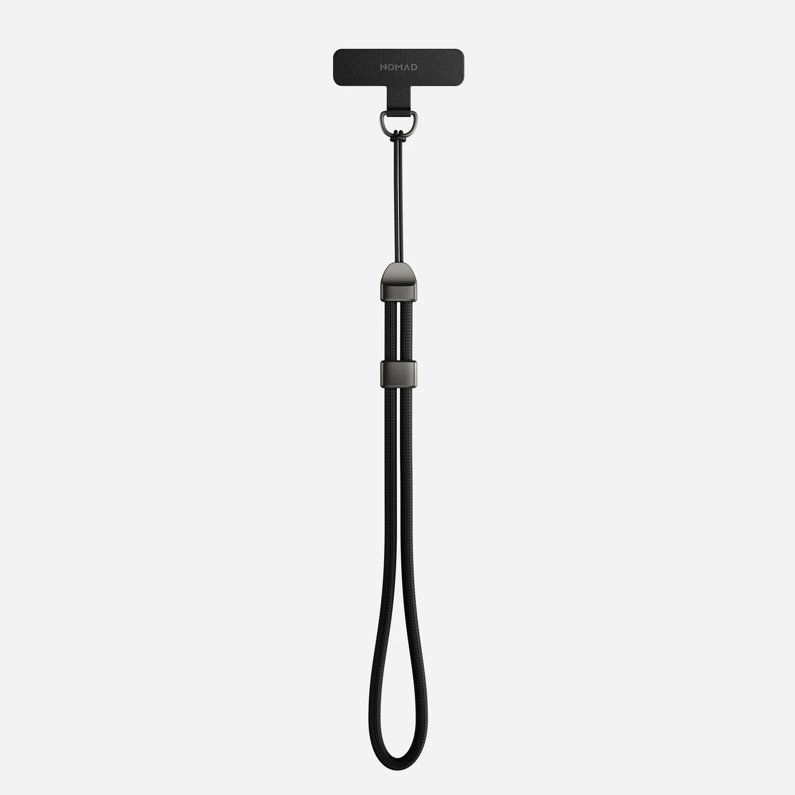 Minimalist black Nomad wrist strap flat lay