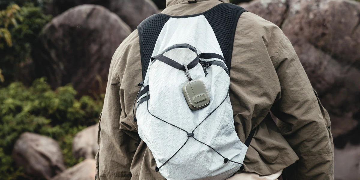 MAGEASY Odyssey outdoor AirPods Pro 3 case worn on a chest strap during hiking