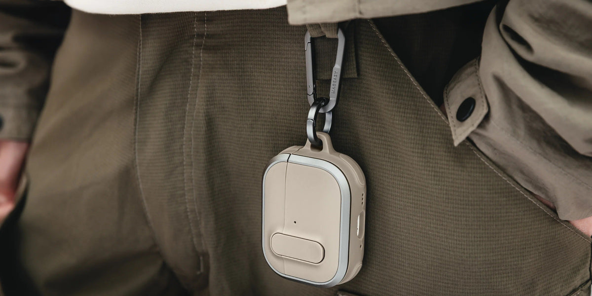 MAGEASY Odyssey outdoor AirPods Pro 3 case in hand with carabiner clip and strap detail